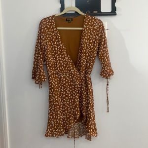 Brown wrap dress purchased at Nordstrom. White flowers fully lined. Size medium